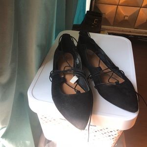 Black laceup flats